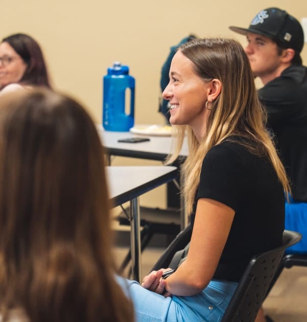 Photo of student at a lecture at SCU